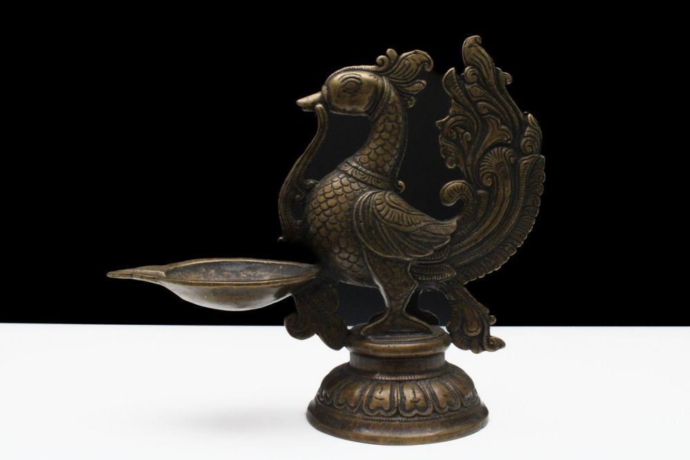 Lot 174: An Indian Bronze Oil Lamp in the Shape...