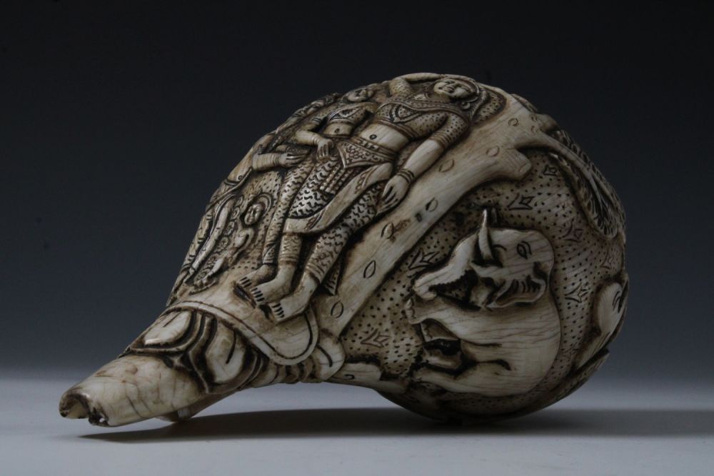 Lot 177: A Tibetan Hand Carved Conch Shell Trumpet Horn.