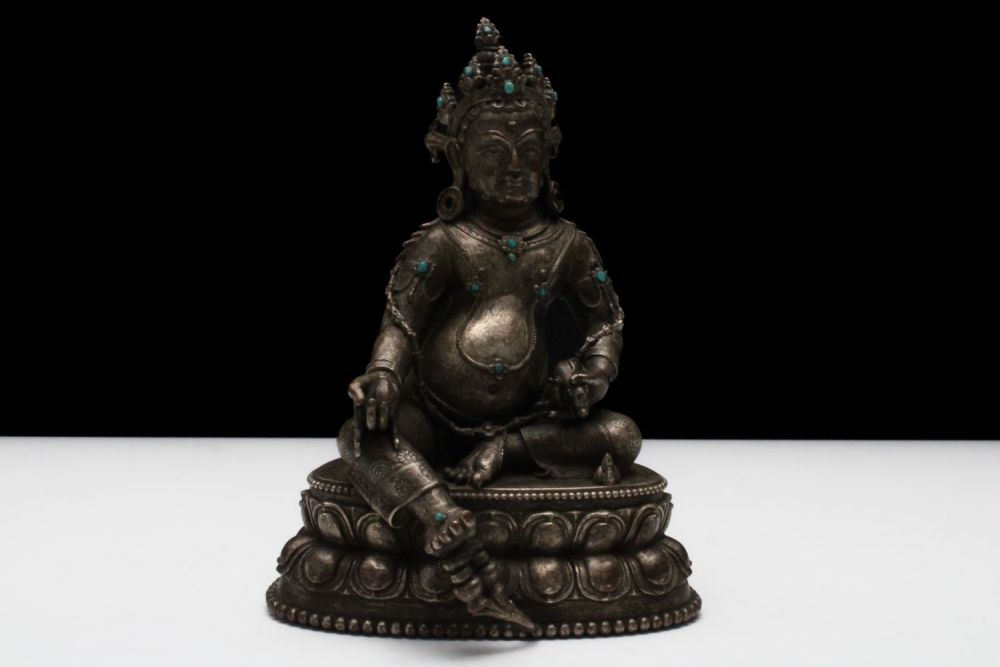 Lot 190: A Tibetan Bronze & Platinum Gilt Jambhala Buddhist...