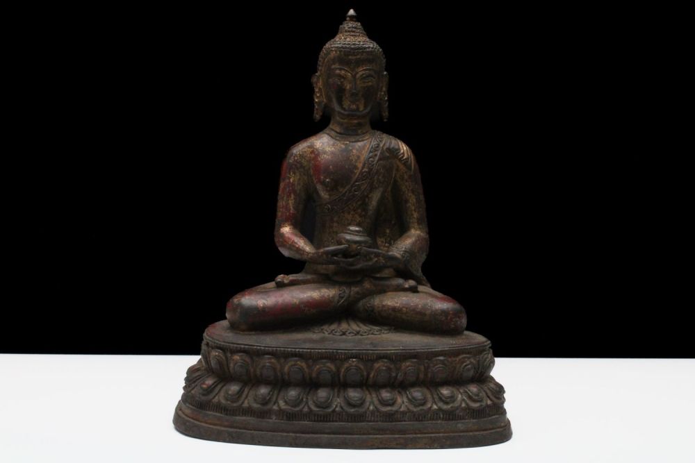 Lot 191: A Tibetan or Nepalese Large Bronze Gilt Bhumisparsha...