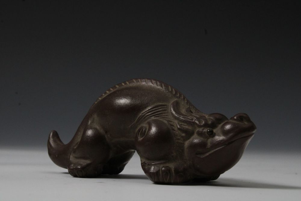Lot 233: A Chinese Yixing Zisha Clay Figure of a...