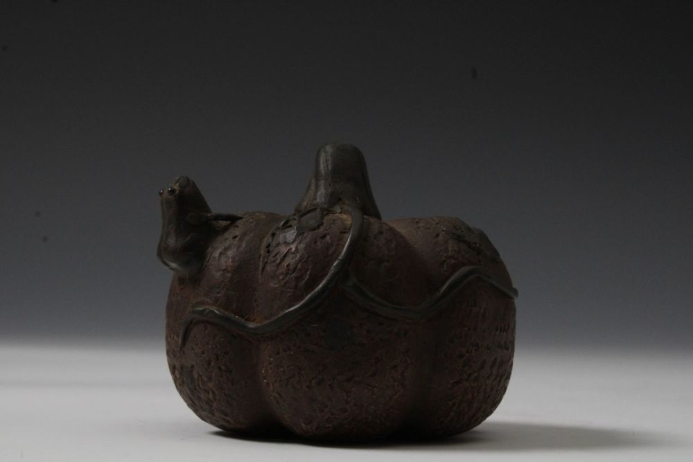 Lot 234: A Chinese Pottery Pumpkin with a Frog on...