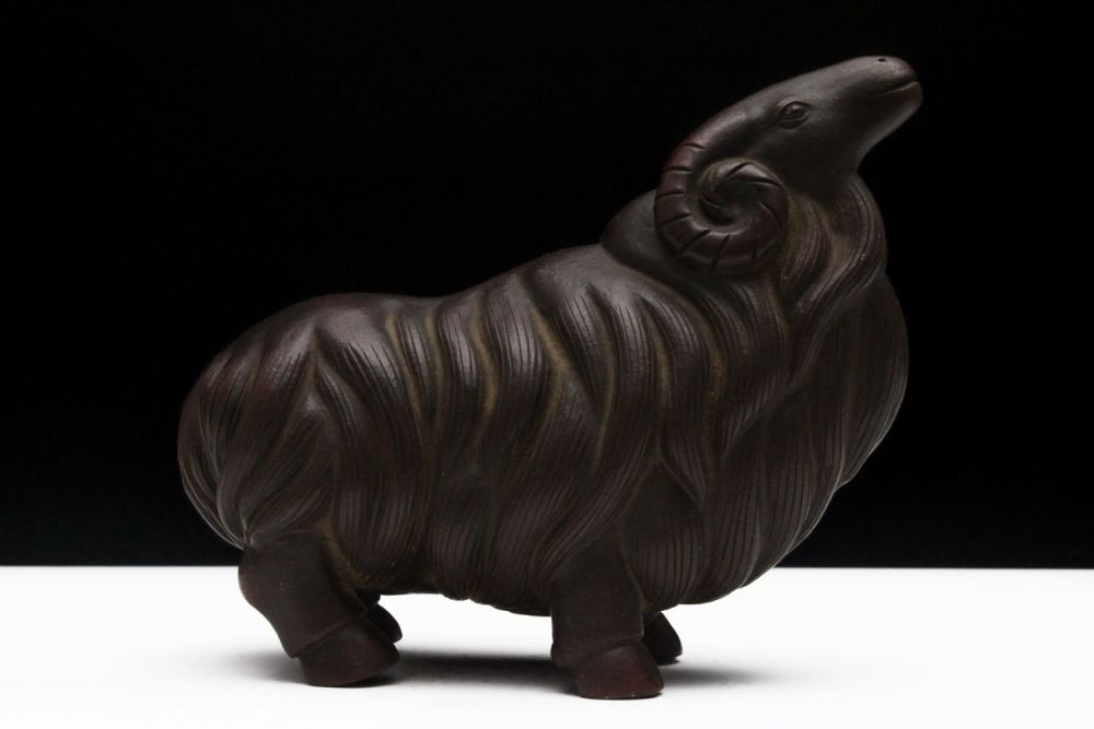 Lot 253: A Chinese Yixing Zisha Clay Figure of a...