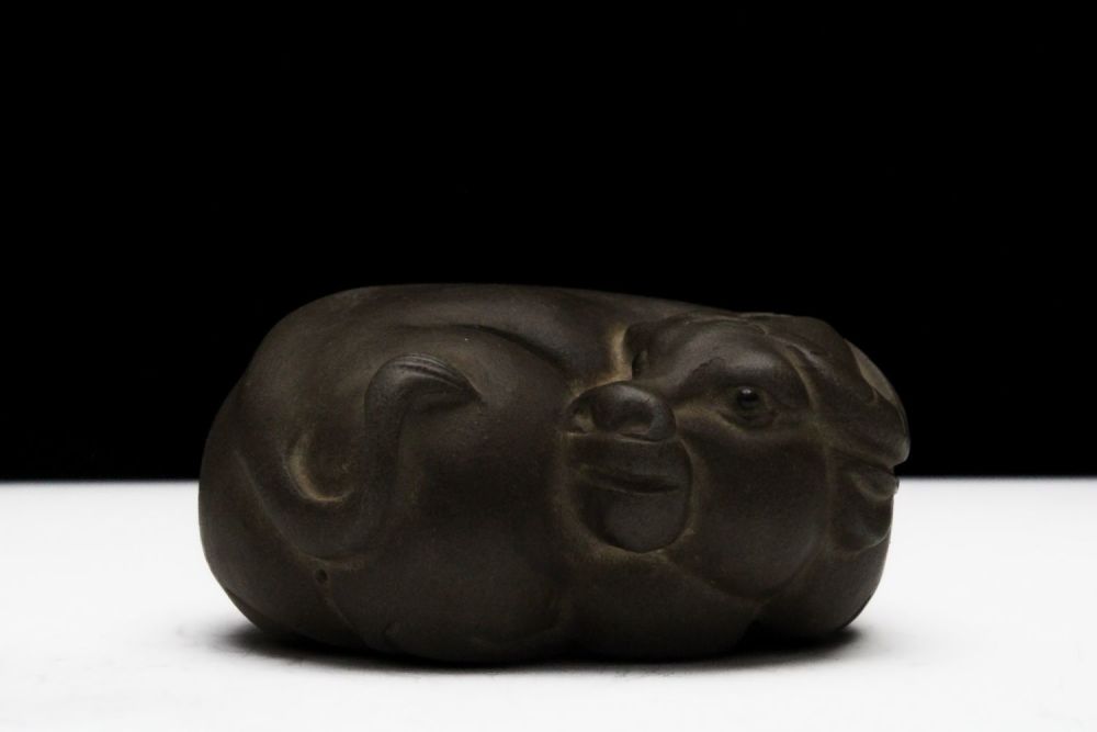 Lot 258: A Chinese Yixing Zisha Clay Figure of an...