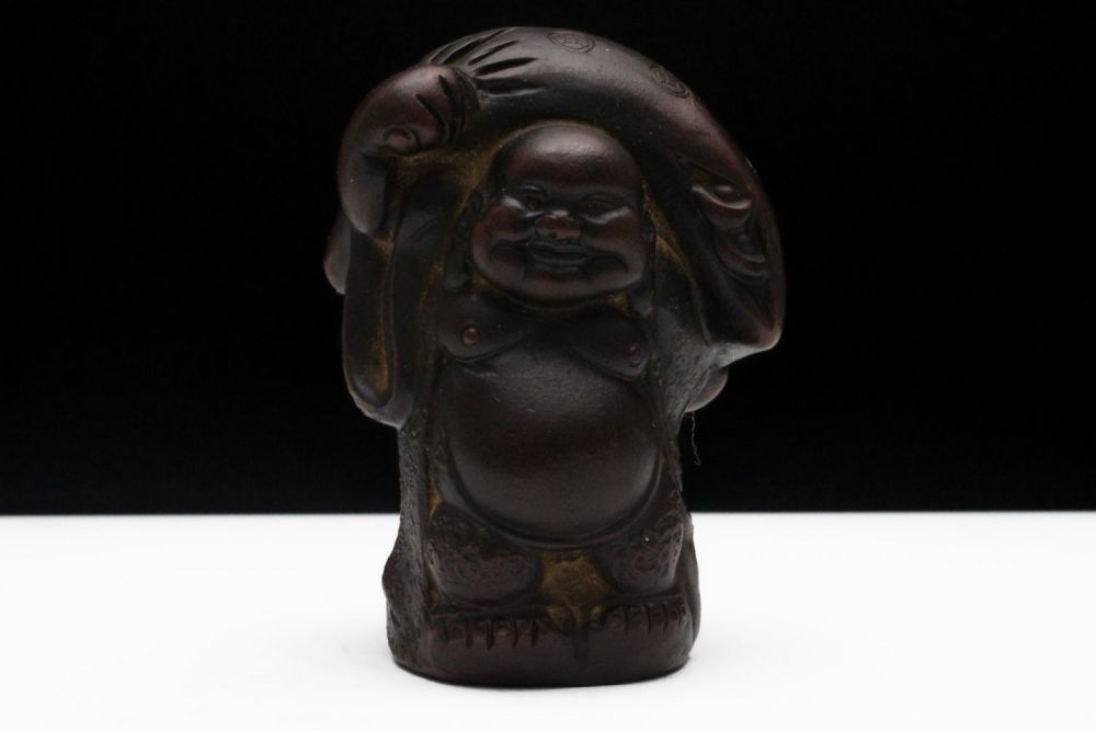 Lot 261: A Chinese Yixing Zisha Clay Laughing Buddha Holding...