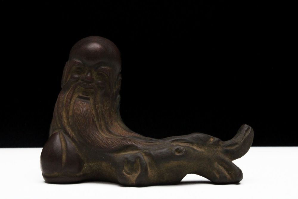 Lot 265: A Chinese Yixing Zisha Clay Figure of a...