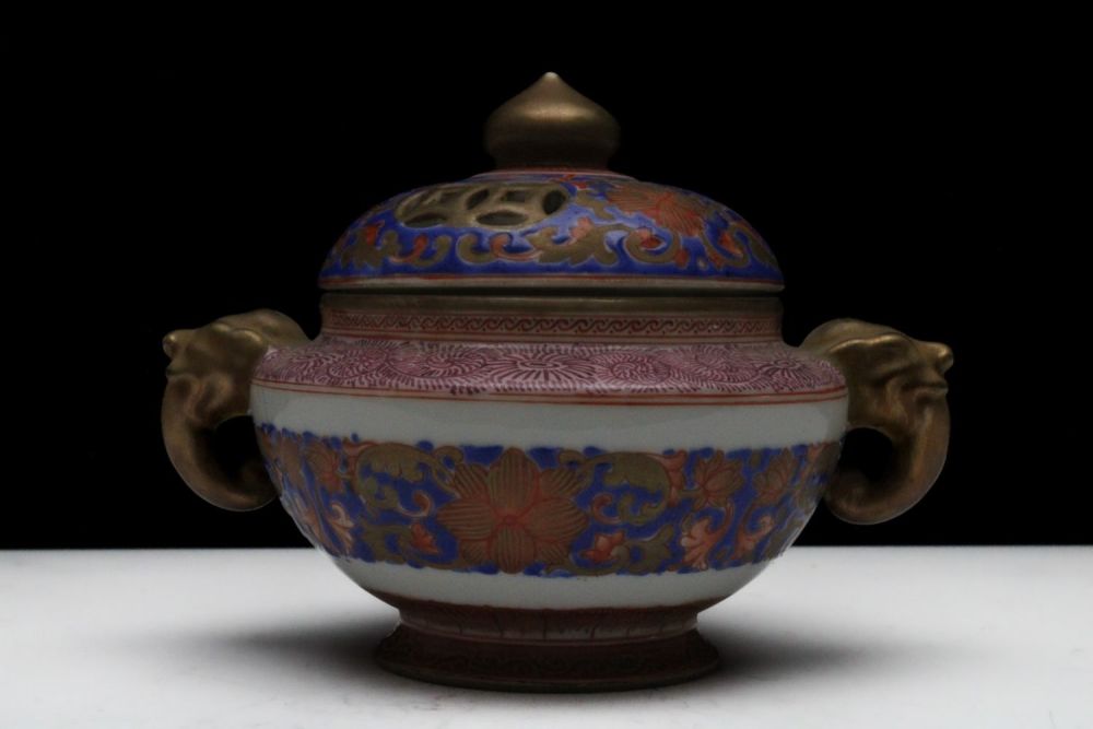 Lot 267: A Chinese Porcelain Incense Burner Depicting Floral Patterns...