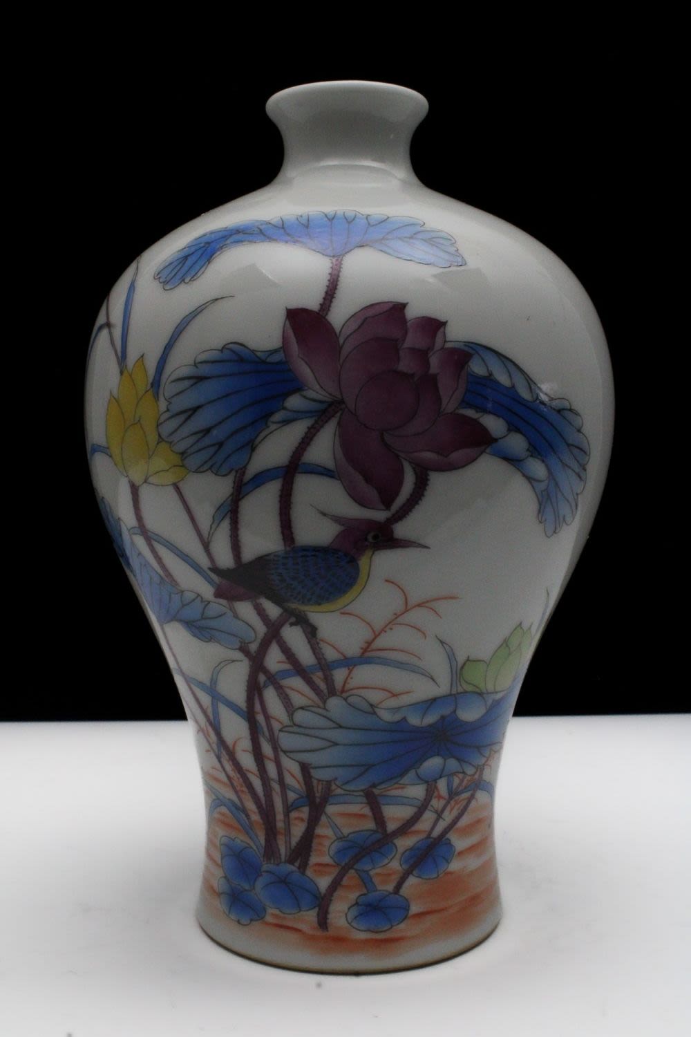 Lot 270: A Chinese Porcelain White Ground Famille Rose Vase...