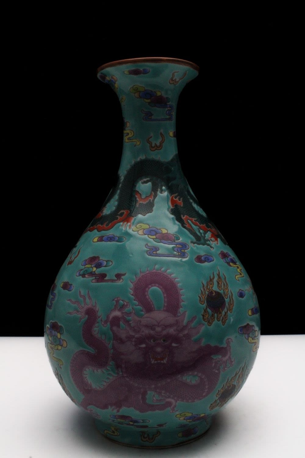 Lot 272: A Chinese Porcelain Blue Ground Famille Rose Vase...