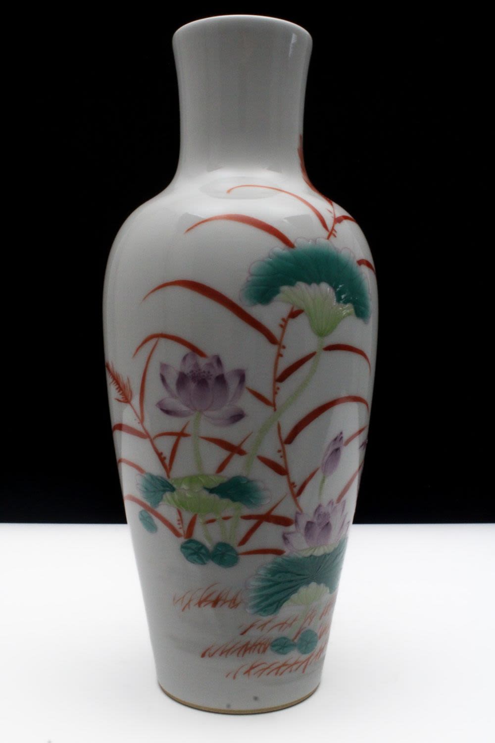 Lot 279: A Chinese Porcelain White Ground Famille Rose Vase...
