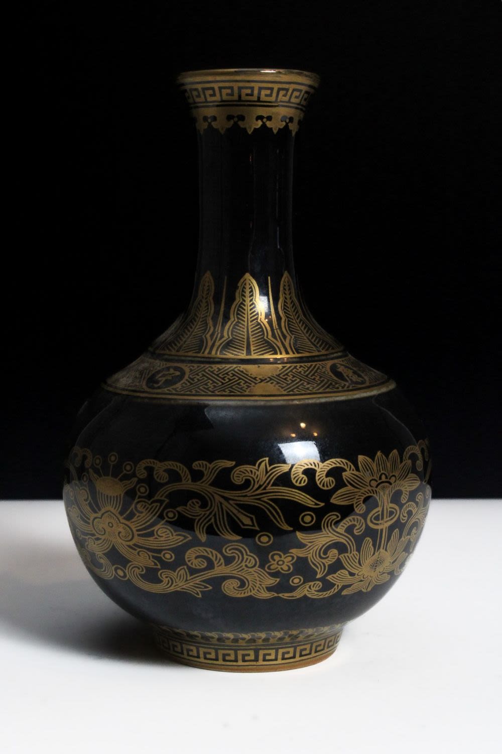 Lot 281: A Chinese Gold Gilt Decorated Porcelain Black-Ground Vase...