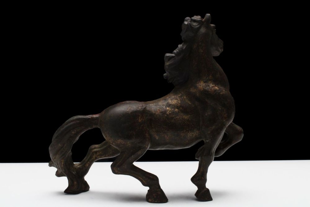 Lot 284: A Chinese Bronze Gilt Figure of a Horse...