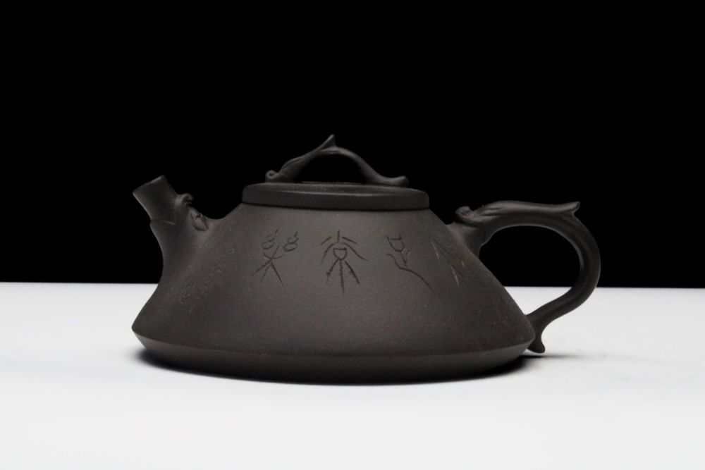 Lot 287: A Chinese Yixing Zisha Clay Tea Pot with...