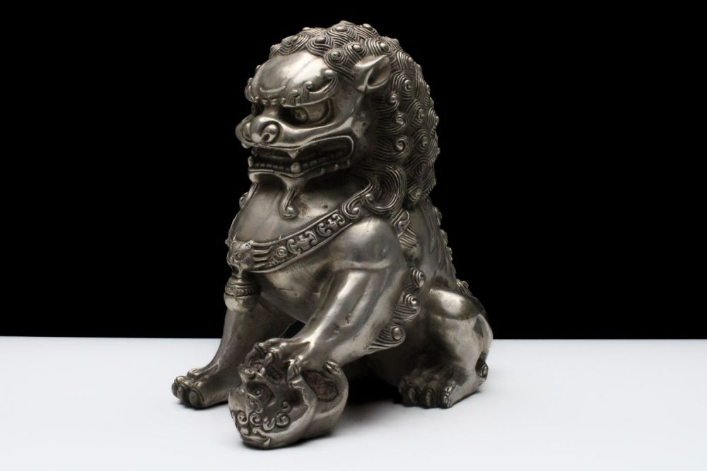 Lot 291: A Chinese White Metal Figure of a Foo...