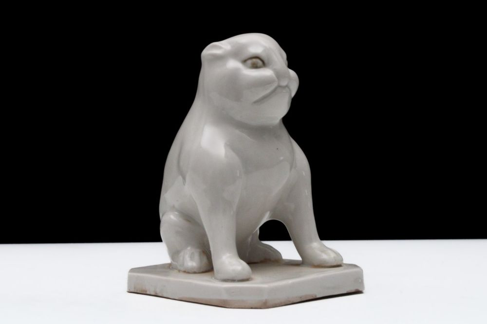 Lot 297: A Chinese White-Glazed Porcelain Figure of a Seated...