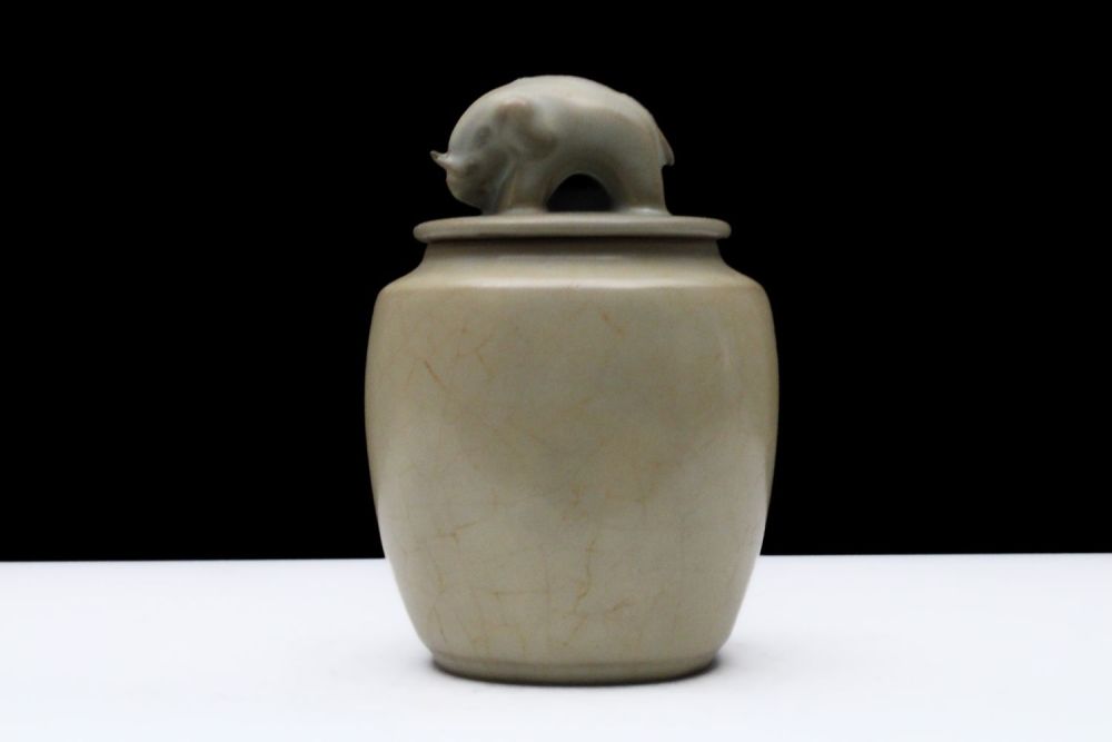 Lot 298: A Chinese Celadon-Glazed Jar with an Elephant Carved...