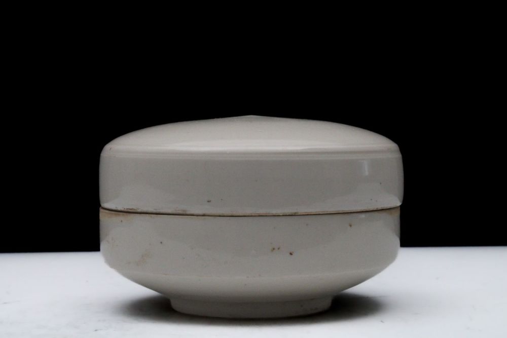 Lot 303: A Chinese White-Glazed Ceramic Round Pot with a...