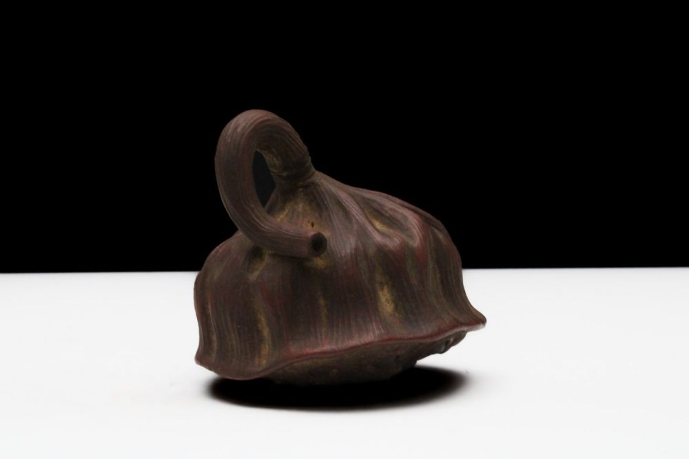 Lot 306: A Chinese Yixing Zisha Clay Lotus Seed Tea...