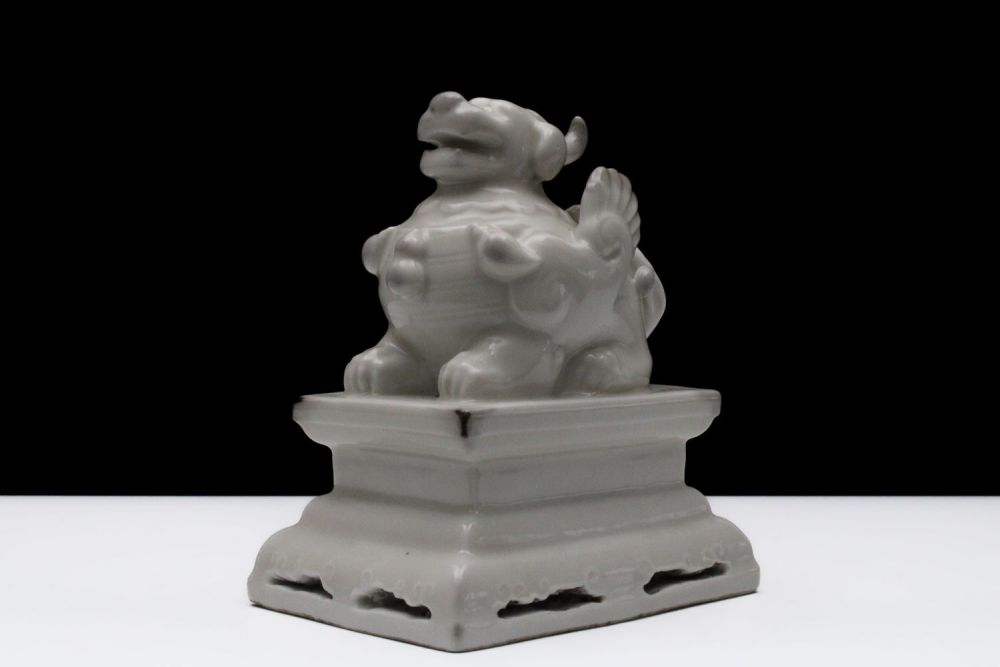 Lot 319: A Chinese Porcelain Figure in the Form of...