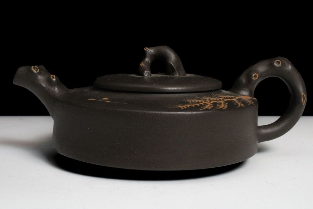 Lot 342: A Chinese Yixing Zisha Teapot with Chinese Inscriptions...
