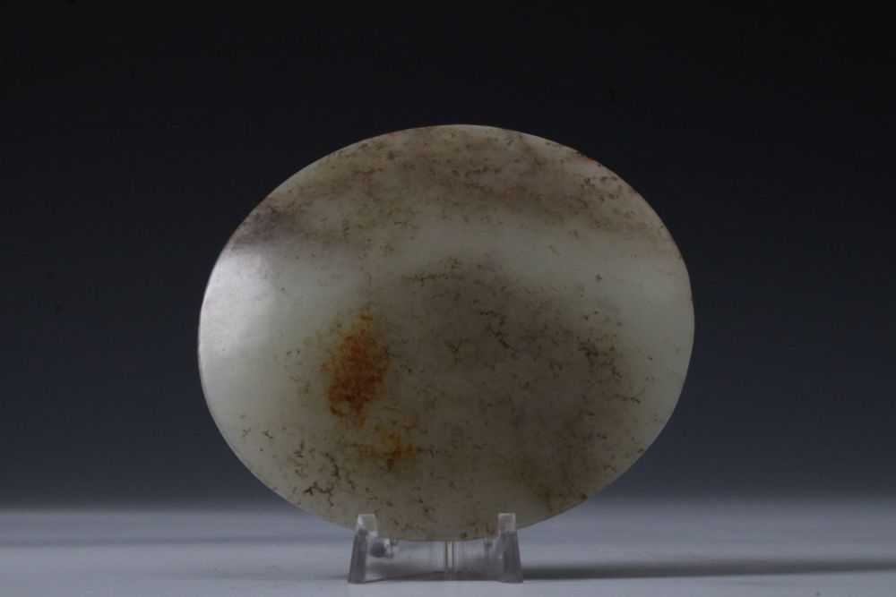 Lot 355: A Chinese Large Jade Hat Button.