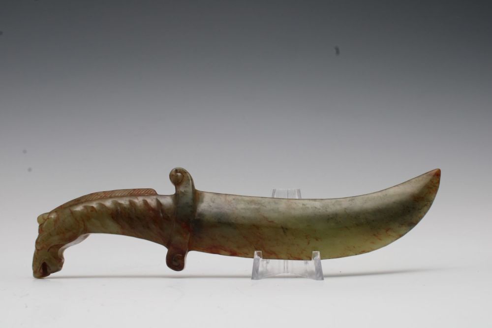 Lot 357: A Chinese Green Jade Dagger.