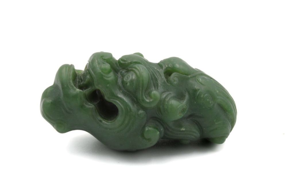 Lot 372: A Chinese Green Jade Pendant Depicting a Dragon's...