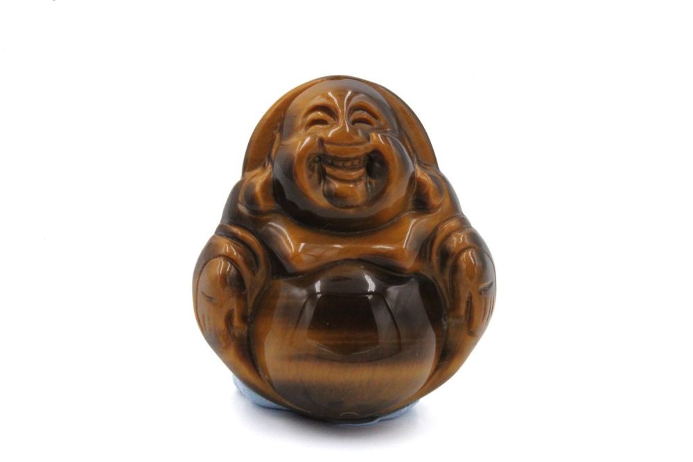 Lot 374: A Chinese Tiger'a Eye Stone Laughing Buddhist Pendant.