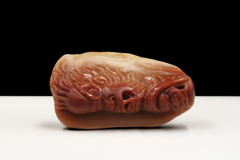 Lot 379: A Chinese Agate Hand Carved Pendant Depicting a...