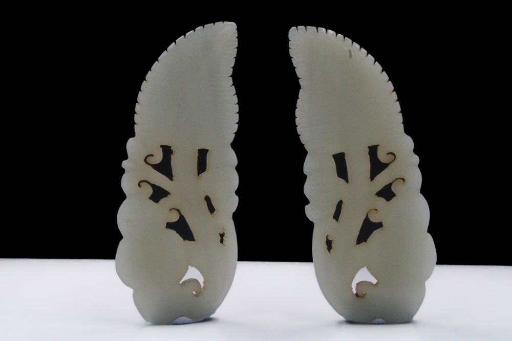 Lot 384: A Pair of Chinese Hand-Carved Jade Clothing Accessories.