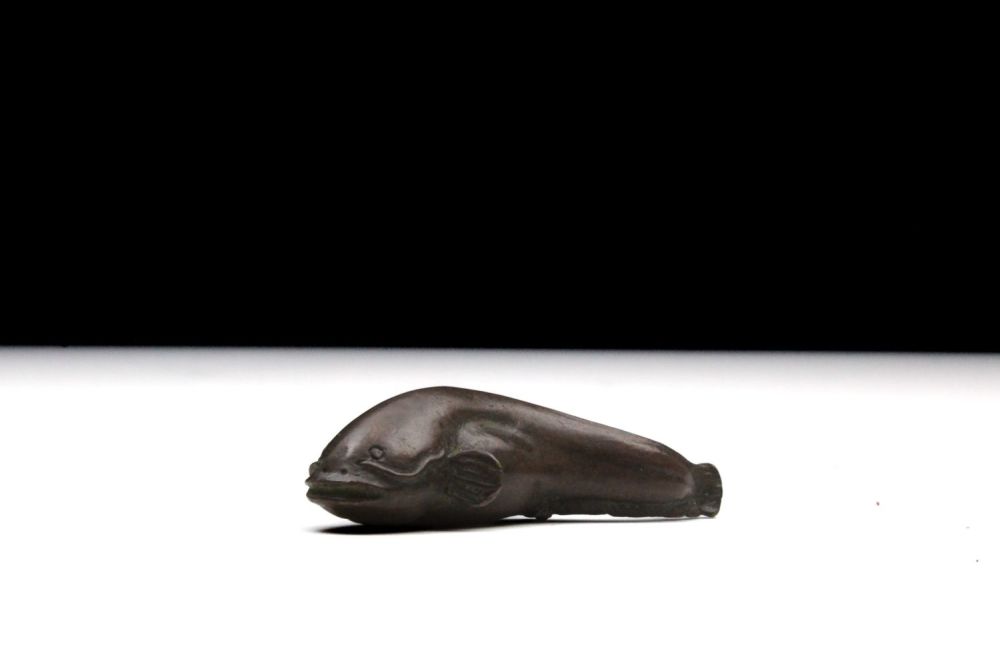 Lot 391: A Japanese Bronze Okimono Figure of a Catfish.