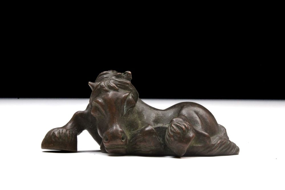 Lot 392: A Japanese Bronze Okimono Figure of a Horse.