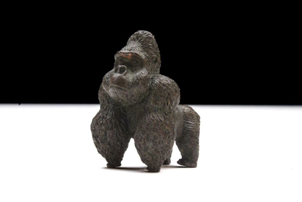 Lot 393: A Japanese Bronze Okimono Figure of a Gorilla.