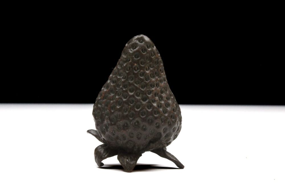 Lot 394: A Japanese Bronze Okimono Figure of a Strawberry.