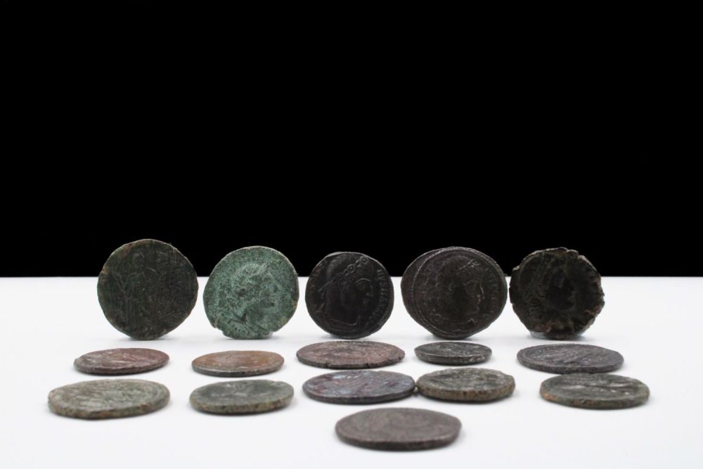 Lot 398: A Lot of 16 Ancient Roman Bronze Coins.