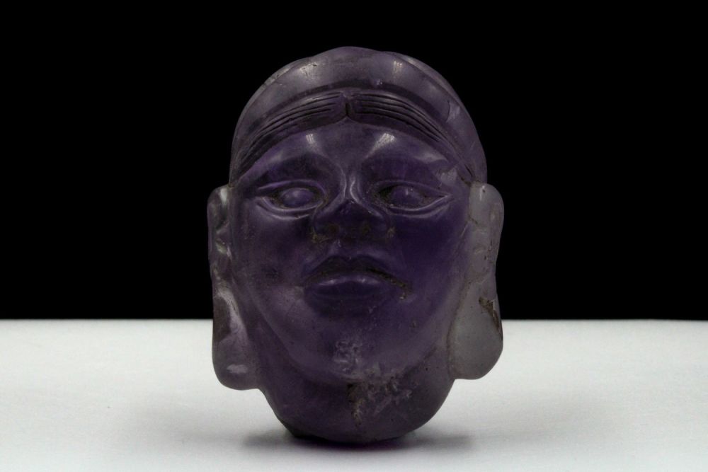 Lot 419: A Rare Middle Eastern Amethyst Carved Head.