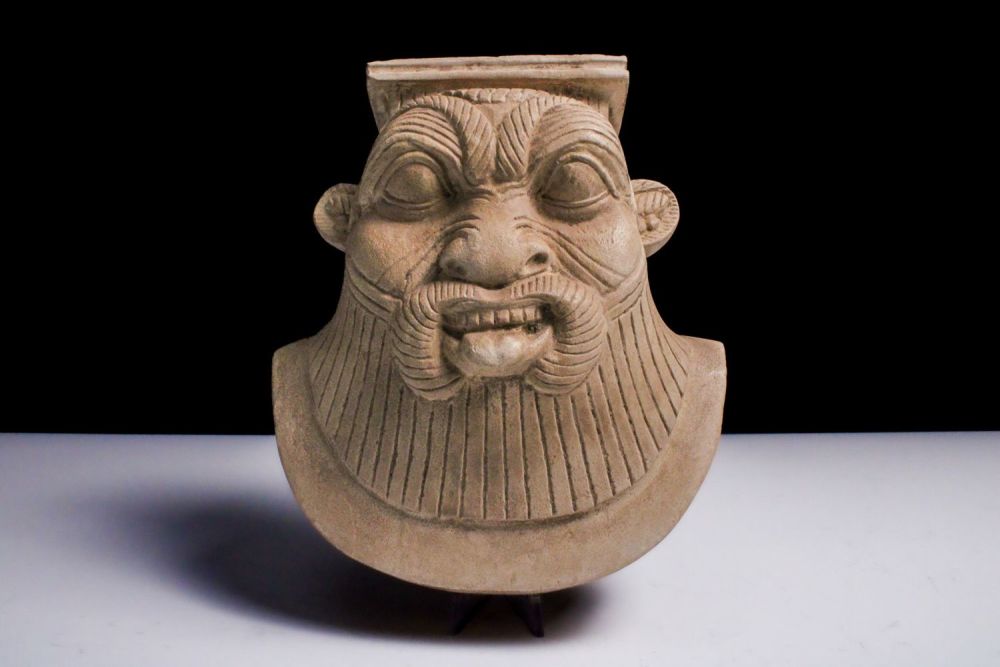 Lot 423: A Large Amulet of Bes in the Style...