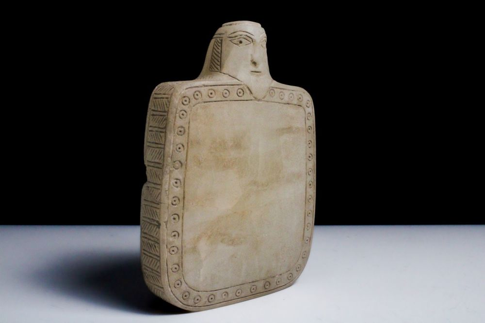 Lot 424: An Alabaster Plaque of the Head of a...