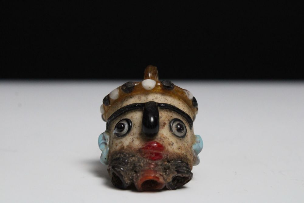 Lot 425: A Glass Head Pendant in the Style of...