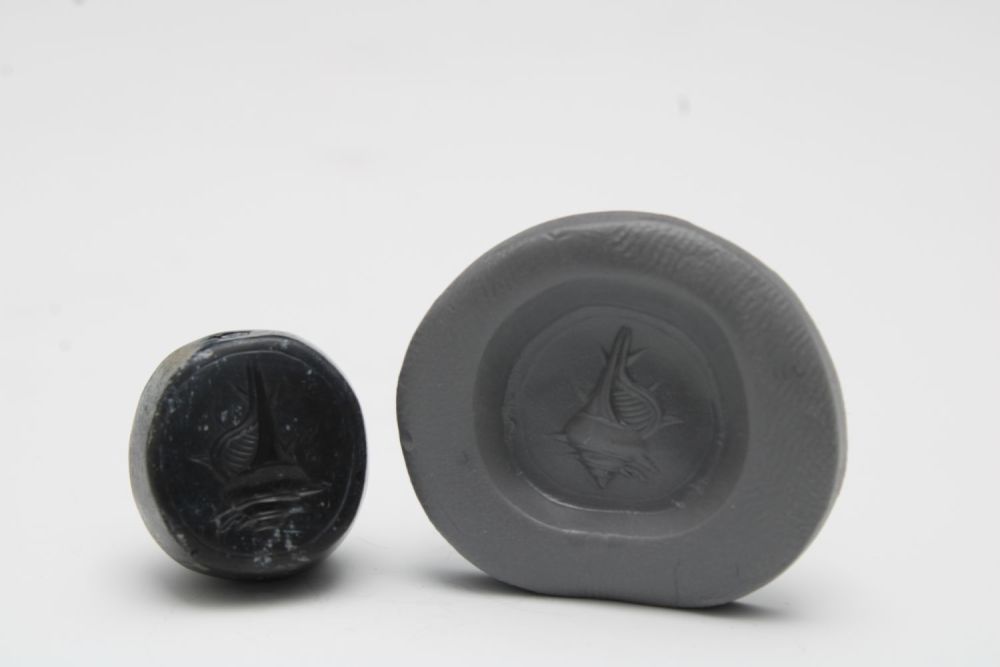 Lot 431: A Greek Carnelian Scarab Depicting a Sea Conch...