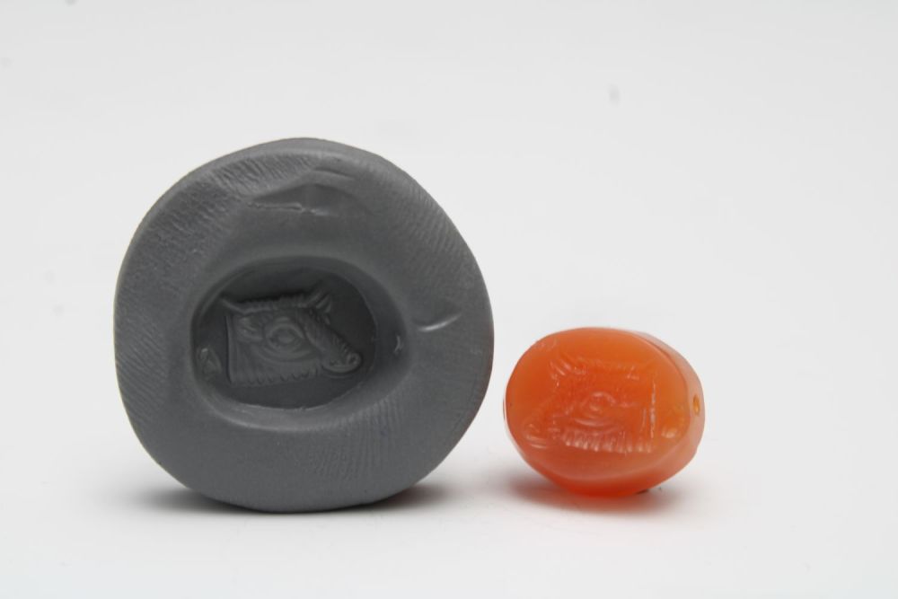 Lot 432: A Greco-Persian Red Agate Scarab Gem Depicting a...