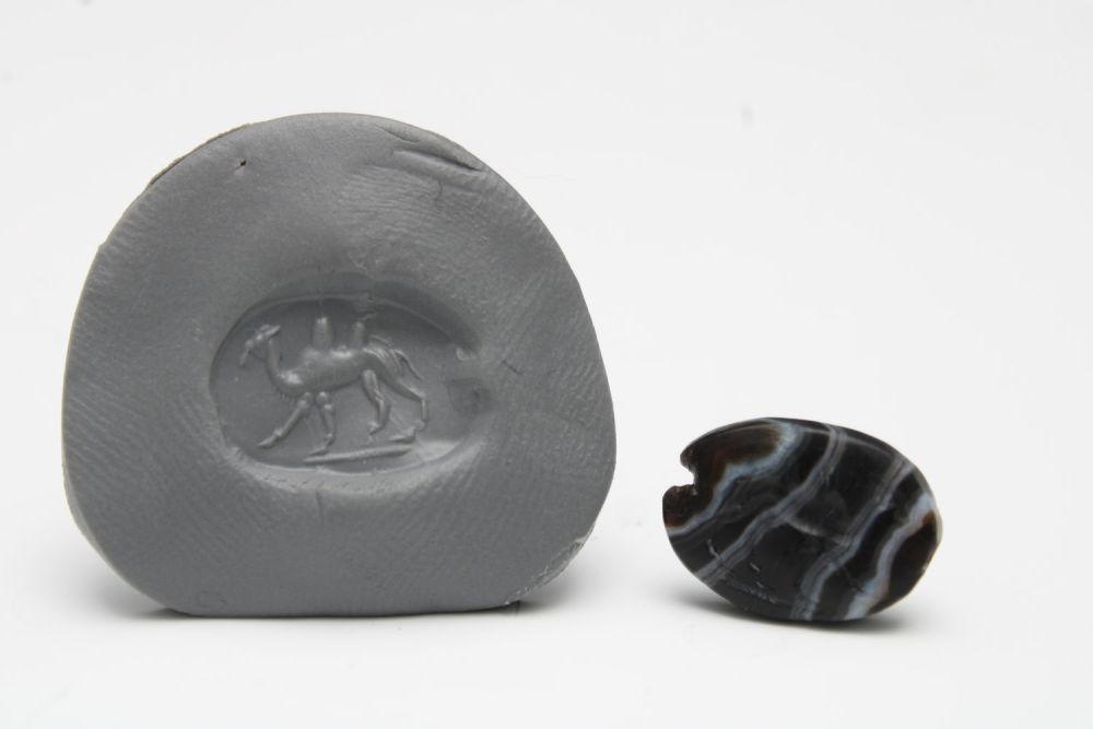 Lot 439: A Fine Greek-Persian Banded Agate Scarab Depicting a...