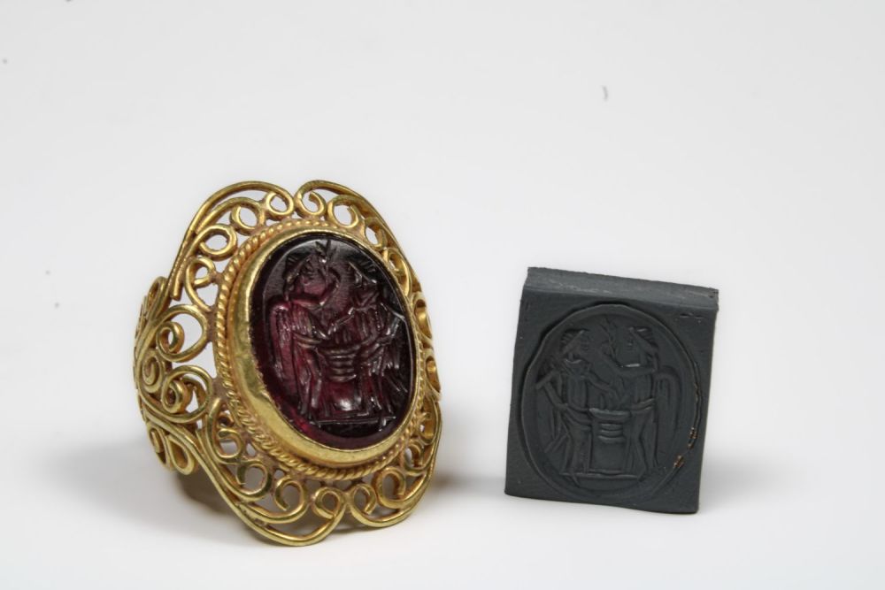 Lot 446: A Gold Ring with Intaglio Depicting a Standing...
