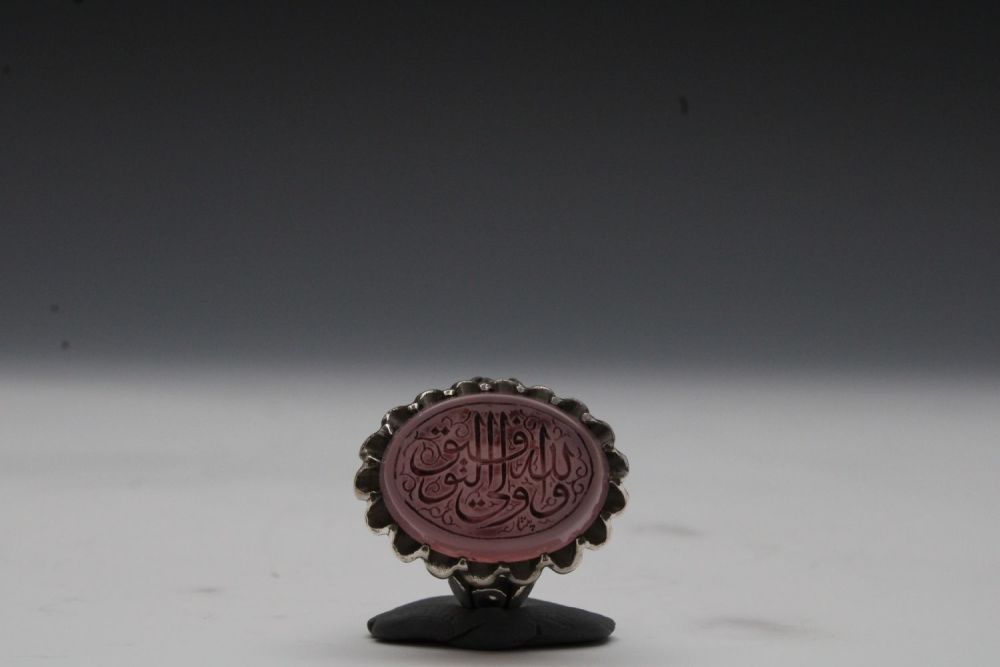 Lot 449: An Islamic Silver Ring with Agate and Islamic...