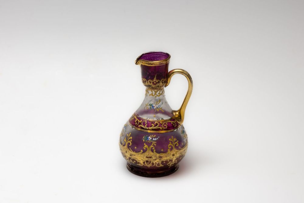 Lot 53: A Vintage Bohemian Purple Glass Jug.