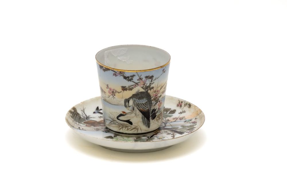Lot 97: A Japanese Porcelain Cup with Saucer Depicting a...