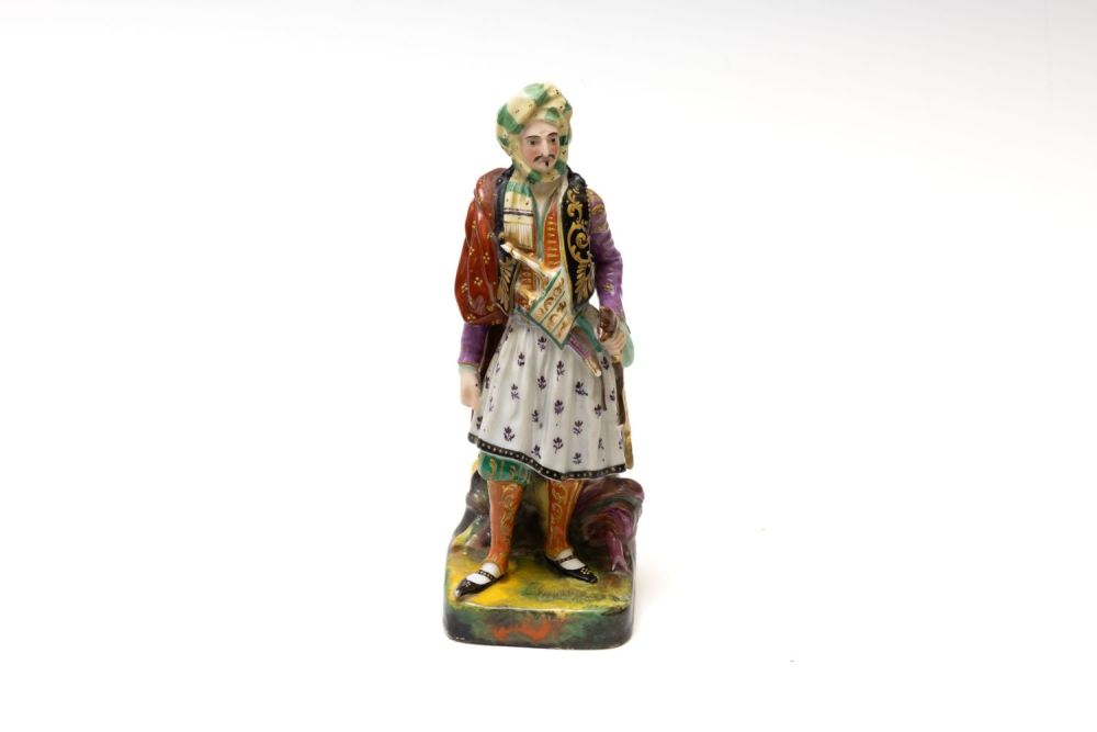 Lot 159: An Islamic Porcelain Figure of a Turkish Man...