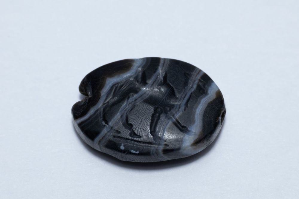 Lot 178: A Fine Greek-Persian Banded Agate Scarab Depicting a...
