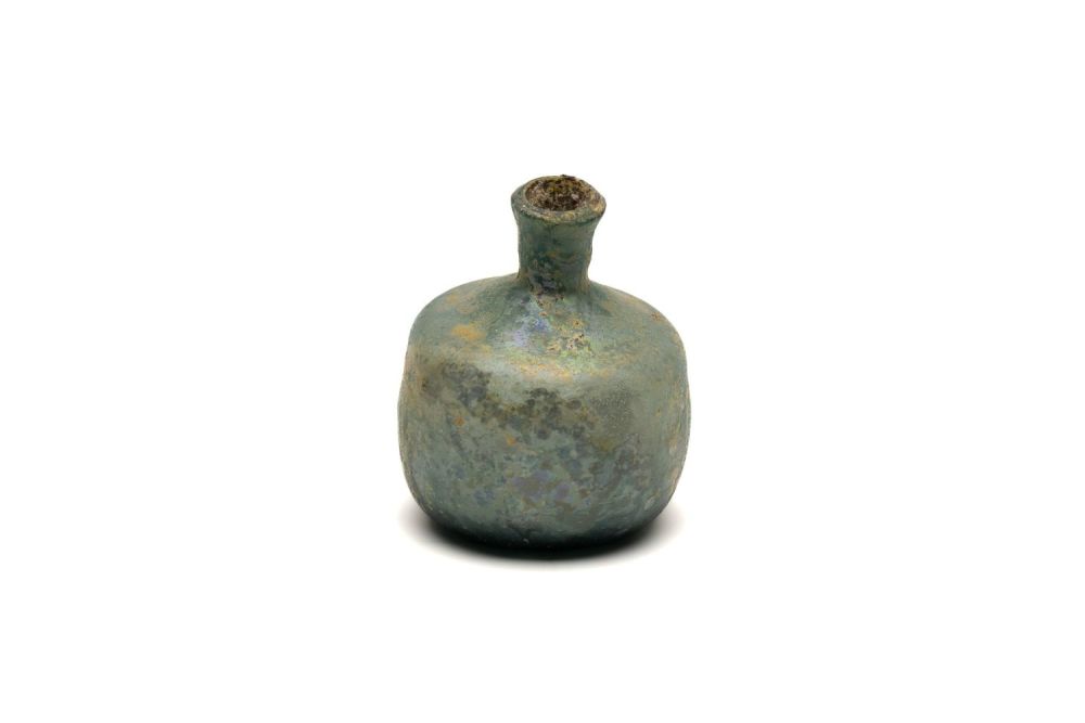 Lot 182: An Islamic Light Green Glass Bottle with Lovely...