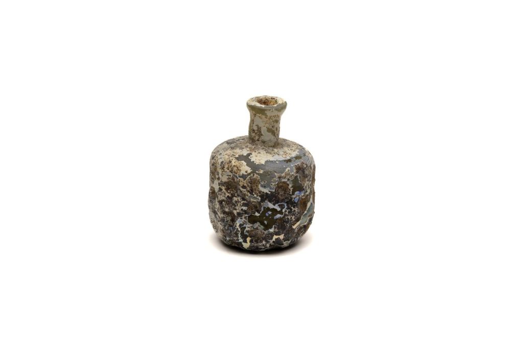 Lot 183: An Islamic Light Green Heavy Glass Bottle with...